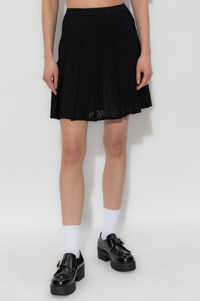 スカート Givenchy PLEATED MONOGRAM SKIRT Givenchy Monogram 72 Jacquard Pleated Mini Skirt – Cettire